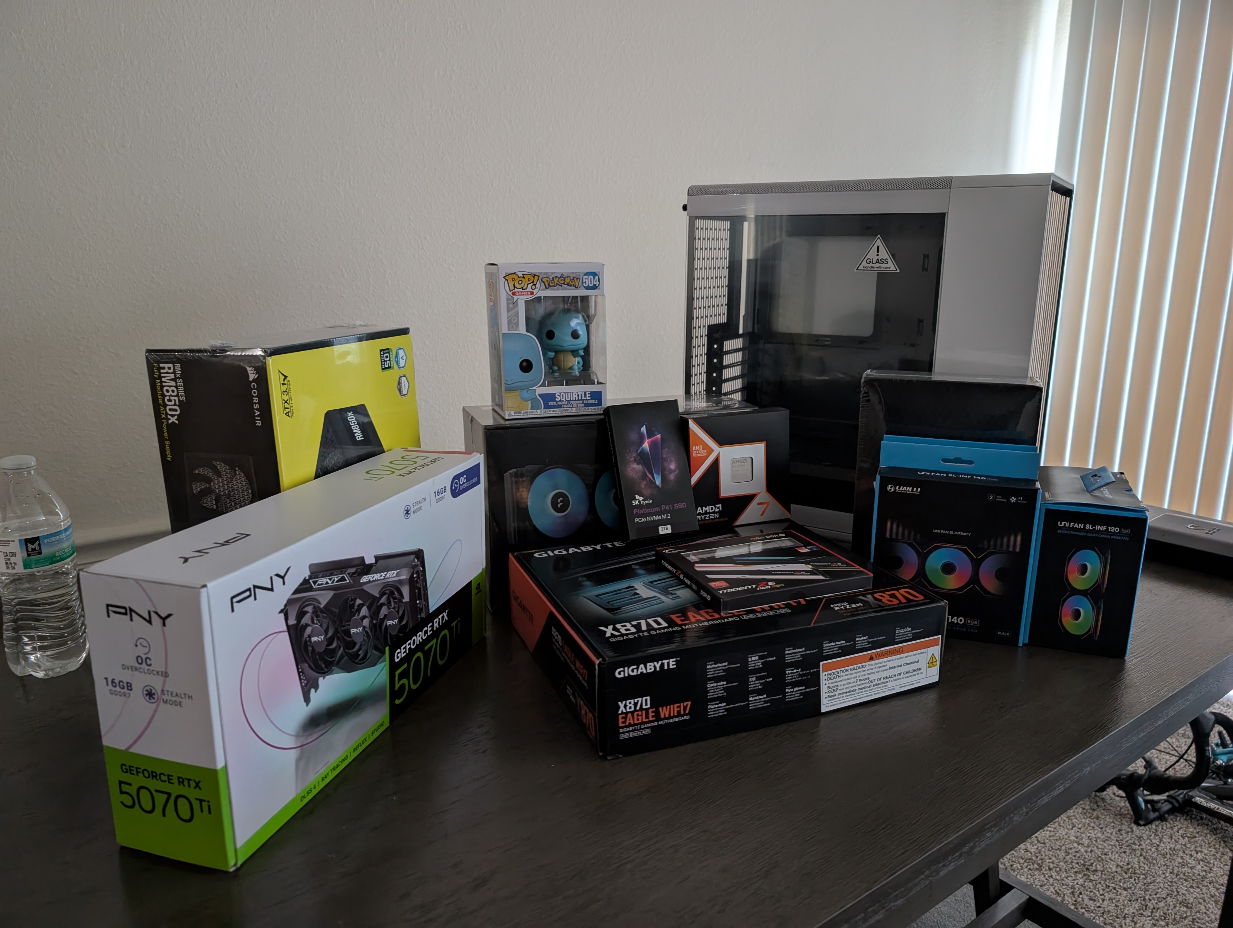 The picture shows all of the acquired computer parts laid out in a dining table.