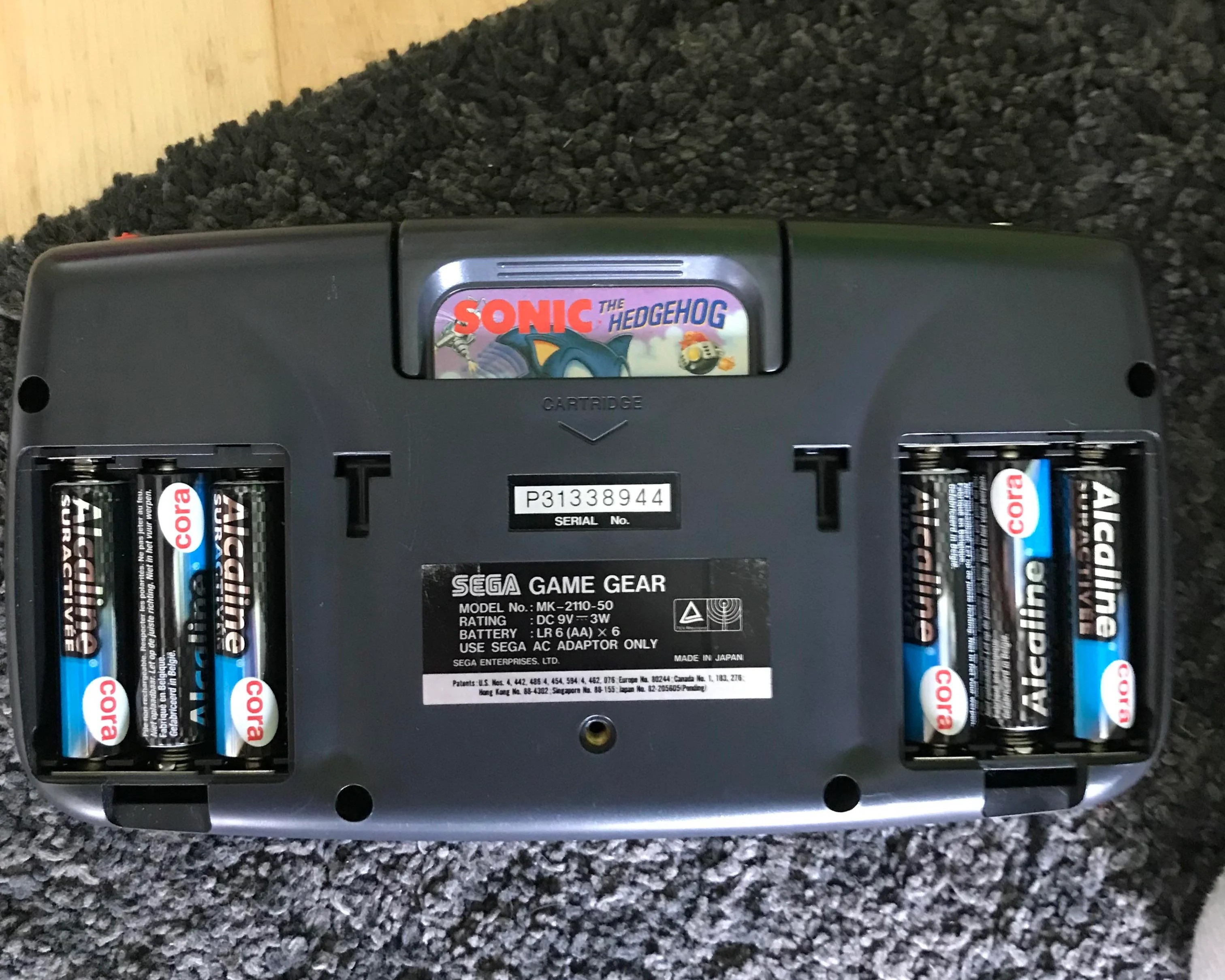 An image of the back of a Gamegear with the battery cover removed.